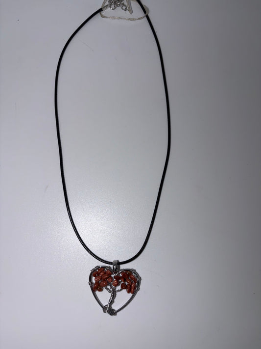 Heart stone wrapped with black cord